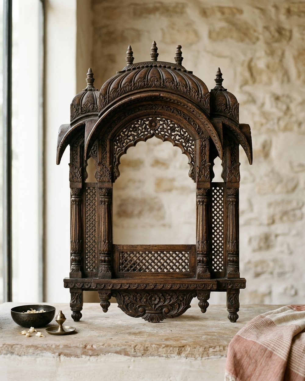 Ornately carved wooden jharokha window frame mounted as wall décor