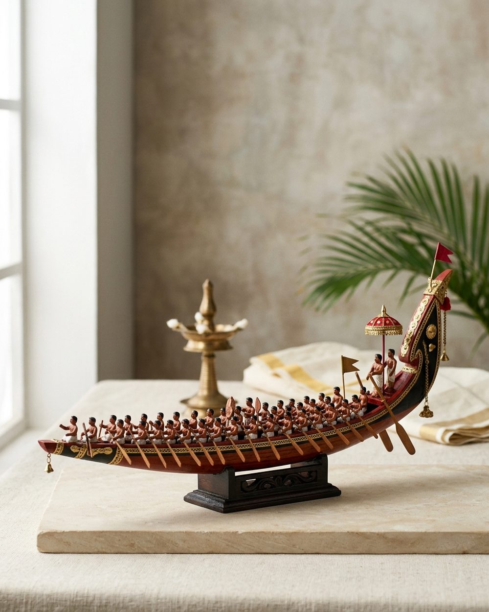 Long tapering wooden model of a Kerala chundan snake boat