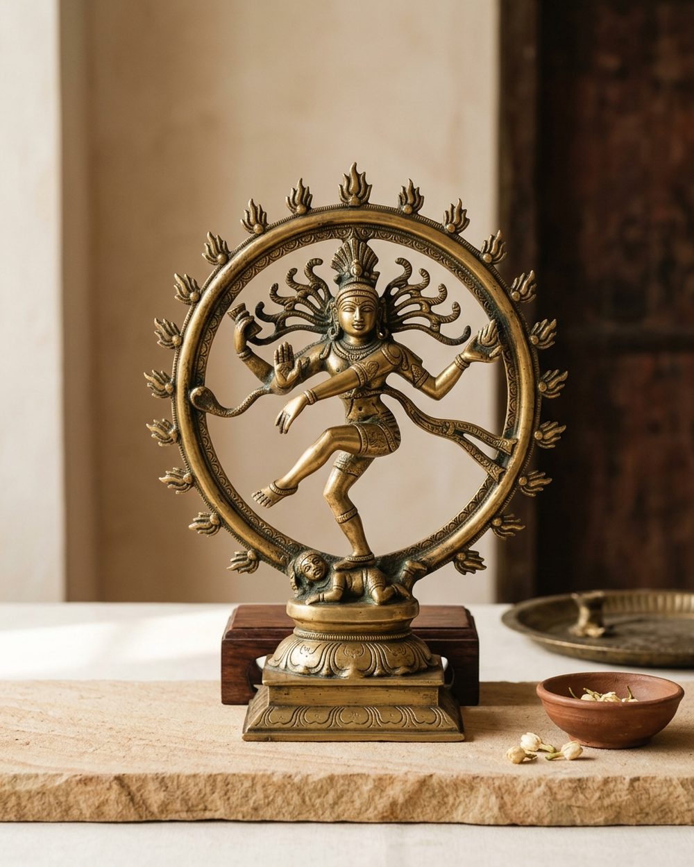 Cast brass Nataraja sculpture of dancing Shiva within a flame ring