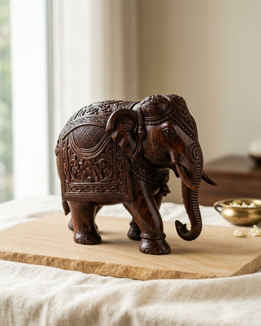 Hand-carved rosewood elephant sculpture with detailed tusks